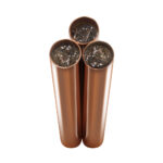 Three copper-colored cylindrical tubes with dark resin material containing metallic fragments visible at the open tops