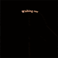 Black gift card with red text reading 'Wishing our' at the top
