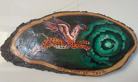 Painted wood slice showing a leopard, bird, and green spiral with text "DECEPTION OF TRUTH" along the bottom edge