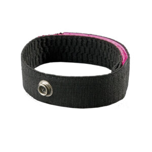 Black fabric wristband with pink interior lining and silver snap button closure, shown against white background
