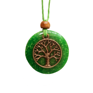 Green circular pendant with copper-colored tree design, brown wooden bead, green cord necklace on white background