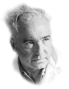 Black and white portrait photograph of an elderly man with wavy gray hair and thoughtful expression