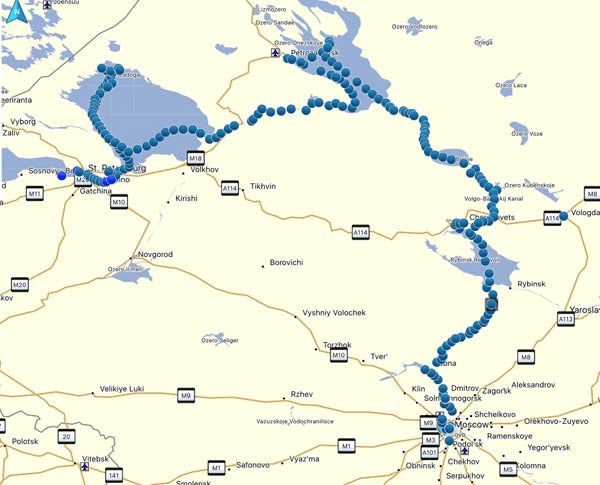 Map showing blue dots marking locations along roads and waterways, with town names and route markers visible